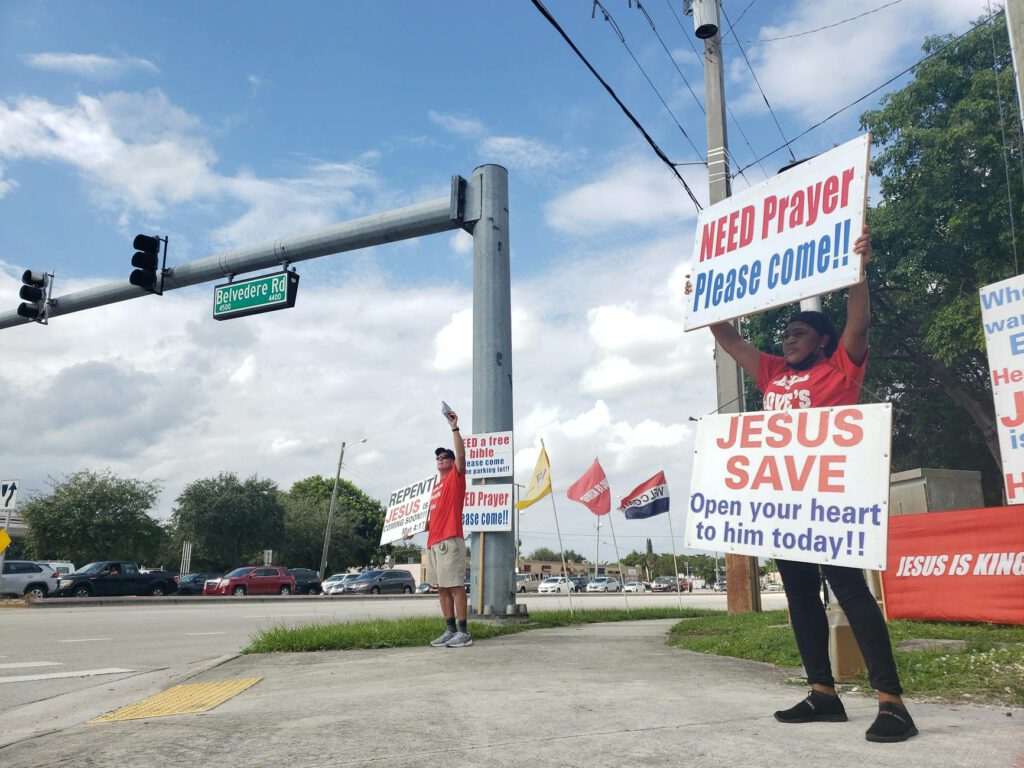 a woman holding a poster